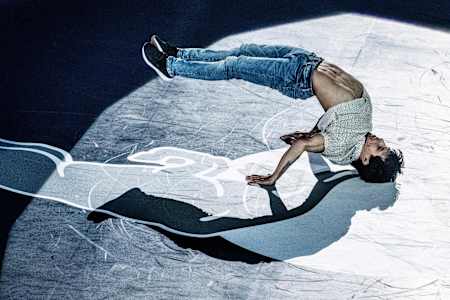 Luka supporting his weight with hands and head while lifting the legs from the ground.