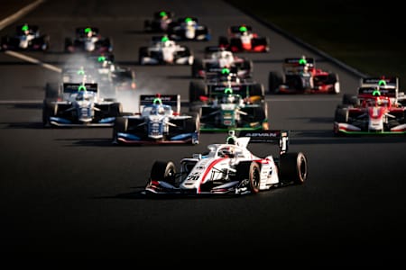 Drivers approach the first turn during a race of the 2020 Super Formula championship.