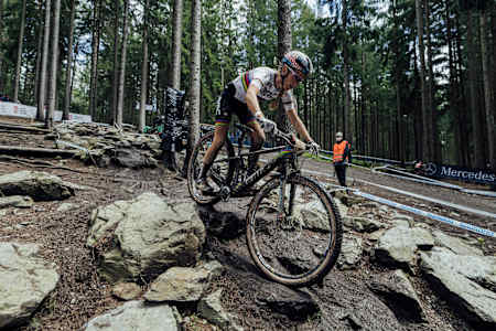 Pauline Ferrand-Prevot races on her BMC Fourstroke at the 2021 UCI World Cup in Nove Mesto in May.