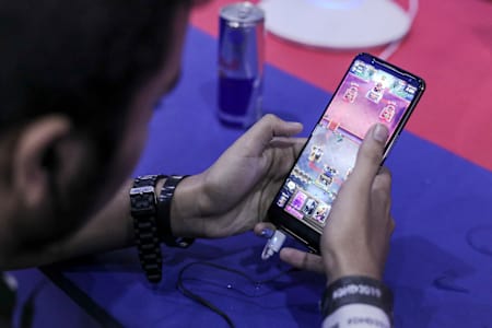 A gamer competes in Clash Royale during Red Bull M.E.O.