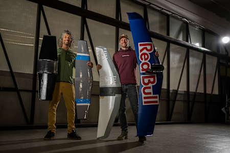 Wingsuit flier Peter Salzmann pictured with the various development models of his ground-breaking wignsuit foil.