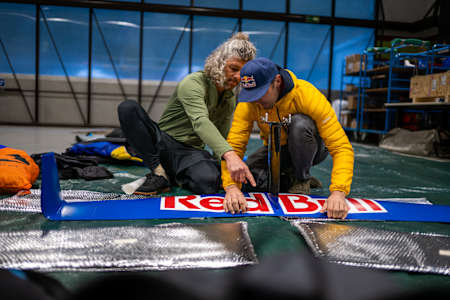 Wingsuit flier Peter Salzmann pictured preparing his radical foil wingsuit for a flight in Jungfrau, Switzerland.
