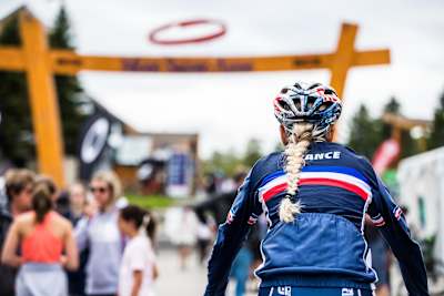 Pauline Ferrand-Prévot rides under the arch at Mont-Sainte-Anne ahead of the MTB World Champs.