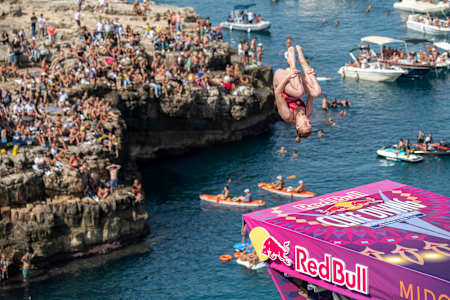 Molly Carlson of Canada dives from the 21.5-metre platform during the sixth stop of the Red Bull Cliff Diving World Series at Polignano a Mare, Puglia, Italy, on September 26, 2021.