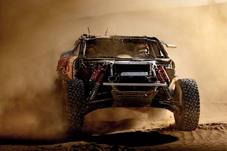 In 2025 Dakar Rally, Carlos Sainz and Lucas Cruz's heavily modified Ford off-road racer kicking up dust in Saudi Arabia.