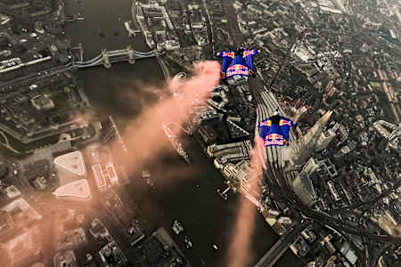 Wingsuiters Marco Fürst and Marco Waltenspiel mid-flight approaching Tower Bridge in London