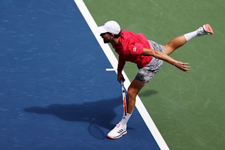 An overhead shot of Dominic Thiem serving at the US Open 2020.