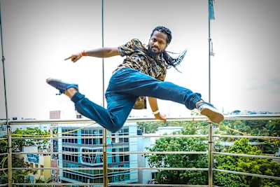 Indian hip-hop dancer Velu Kumar poses for a profile photo.