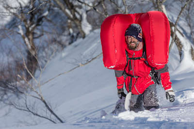 John Jackson moments after pulling open his avalanche pack to safely rise to the top of the moving snow in Hakuba, Japan
