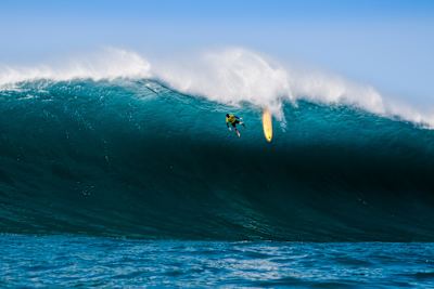 Surfer Kohl Christensen pictured bailing on a wave in a photograph shot by Christa Funk.