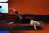 A mountain biker does a push-up with twist variation.