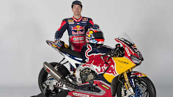 World Superbike rider Nicky Hayden poses with his Honda