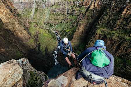 Rob Warner abseils down a huge mountain in Maletsunyane, Lesotho.