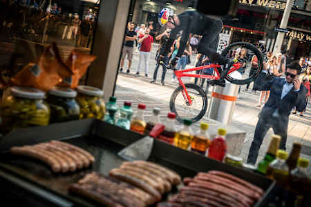 Fabio Wibmer balances on his Trial Bike on a stone.