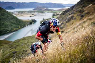 Competitors run uphill during Red Bull Defiance.
