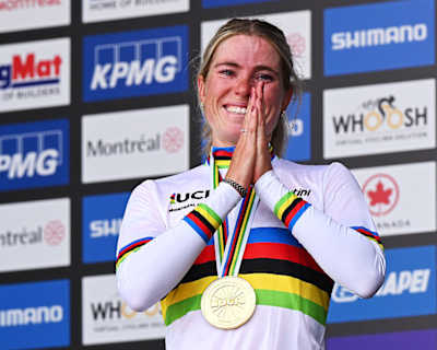 Demi Vollering celebrates her victory in the road race at the 99th UCI Road World Championships in Montreal, Canada. 