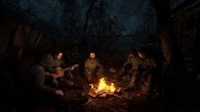 Screenshot aus STALKER 2 zeigt ein paar Kopfgeldjäger am Lagerfeuer.