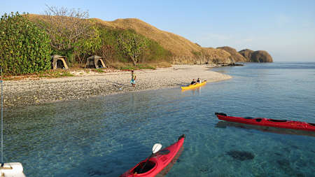 Kayaking as seen off the shores of Komodo Island in Indonesia.