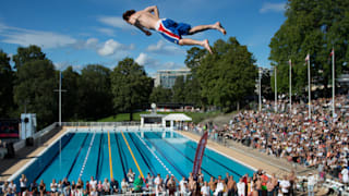 A diver above a pool at contest