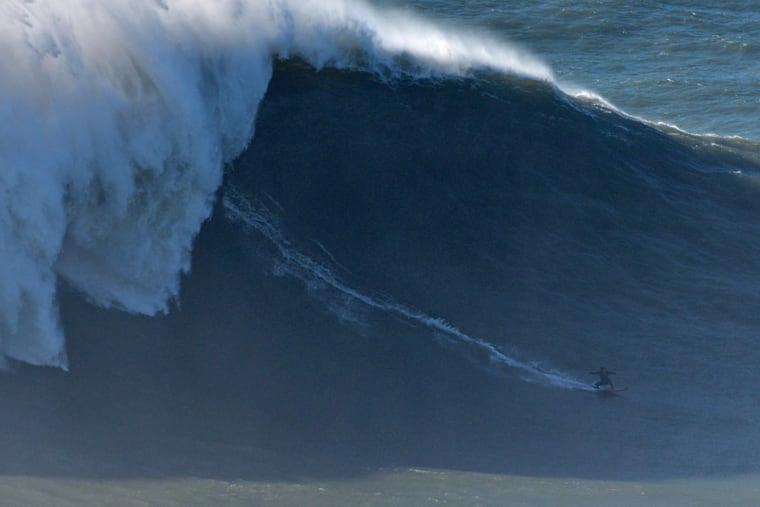 Justine Dupont Surfs Biggest Wave In Nazare Portugal