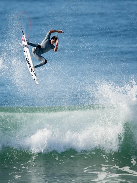 Julian Wilson performs an aerial while surfing at Jeffreys Bay, South Africa.