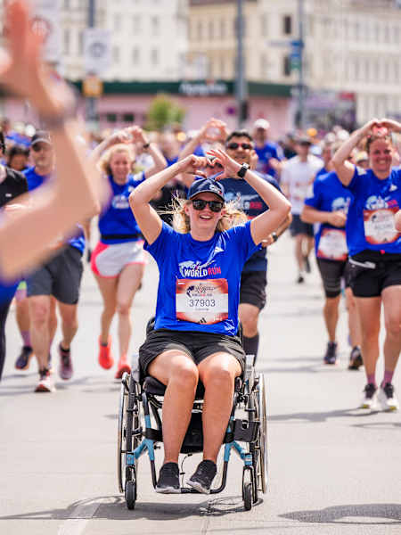 Excitement at the 2026 Wings for Life World Run as participants, including wheelchair athletes, make their way through Vienna, Austria, united in support of spinal cord research