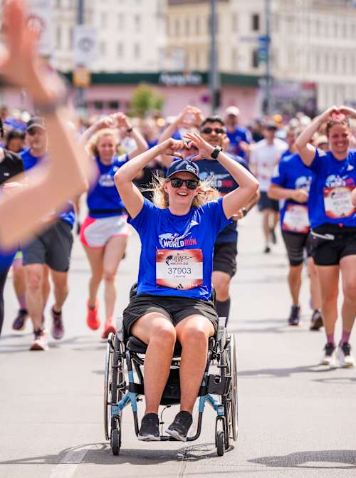 Excitement at the 2026 Wings for Life World Run as participants, including wheelchair athletes, make their way through Vienna, Austria, united in support of spinal cord research