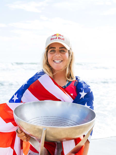 Caroline Marks and the world surfing champion trophy