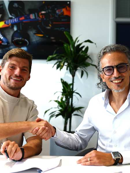 In 2026, Max Verstappen shakes hands with Red Bull Racing team principal Laurent Mekies during his contract renewal in Milton Keynes, extending his deal until 2030.