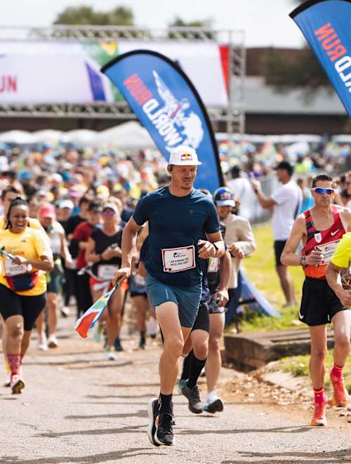 Thomas Van Tonder leads the charge with fellow runners at the 2025 Wings for Life World Run App Run in Pretoria, South Africa, representing Red Bull's unstoppable energy