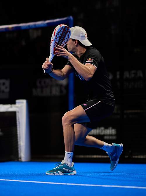 Red Bull athlete Juan Lebrón Chincoa in action at the Cancun Premier Padel P2 quarter-finals in Mexico on March 14, 2025, bringing unmatched energy to the vibrant blue court