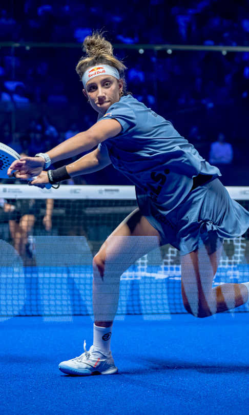 Beatriz González dives for a winning shot during the Premier Padel 2025 Finals semifinals in Barcelona, Spain, showcasing Red Bull's thrilling energy on court.