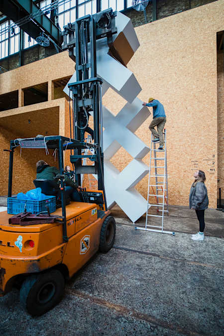 A sculptural representation of the 3X symbol of Amsterdam is assembled in the city's STRAAT Museum as the 'canvas' for artwork by Red Bull Doodle Art World Final judge Mr Doodle in April 2023.