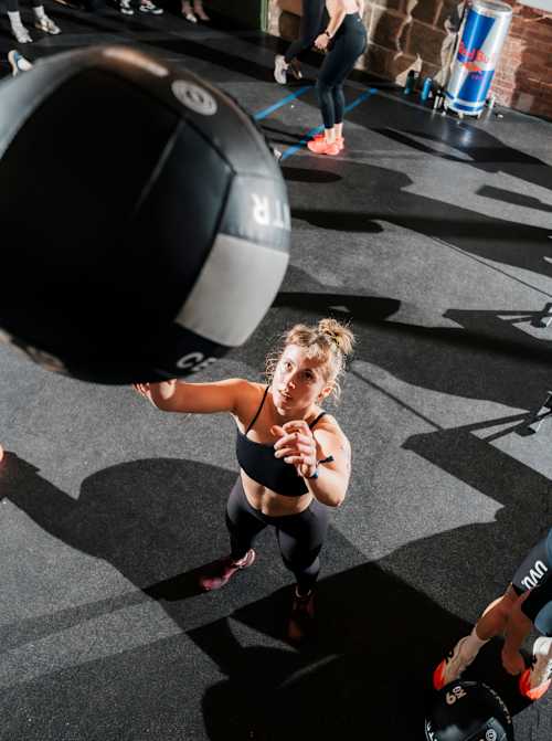 A HYROX athlete performs during the Wall Balls.