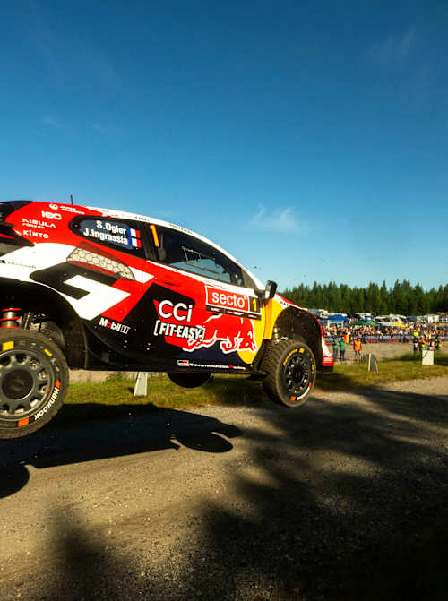 Sébastien Ogier and Julien Ingrassia launch the Toyota Gazoo Racing World Rally Team car over a gravel jump during the 2026 World Rally Championship in Jyväskylä, Finland.