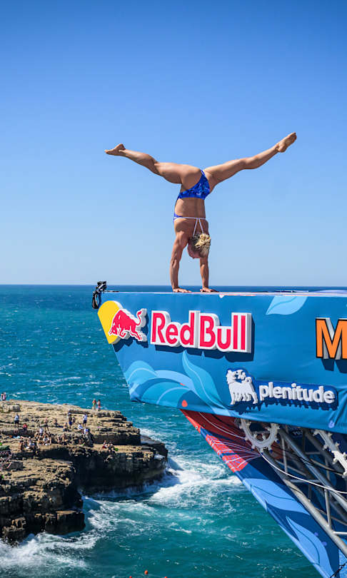 Lisa Faulkner of the USA prepares to launch an armstand dive from the 22 metre platform at the Red Bull Cliff Diving World Series in Polignano a Mare, Italy on June 29, 2025.