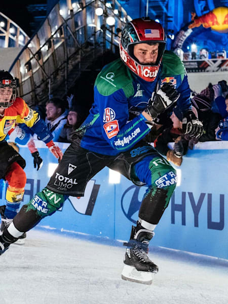 Photo of Ice Cross Downhill skaters in action.