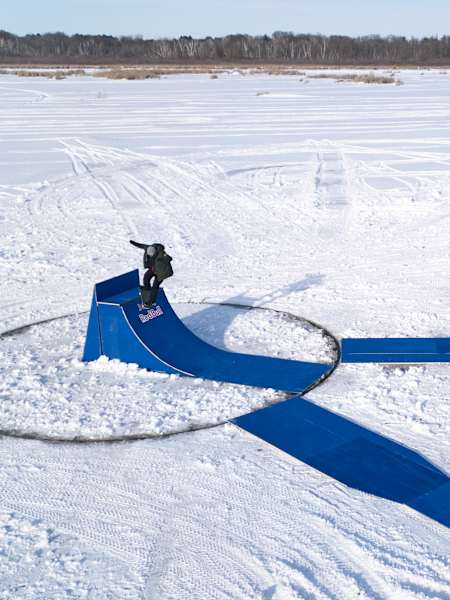Winter skateboarding with a twist on a frozen lake