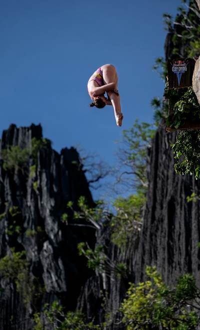 Molly Carlson of Canada executes a stunning dive from 21.5 metres during the inaugural Red Bull Cliff Diving World Series 2025 at Lagen Island, El Nido, Philippines