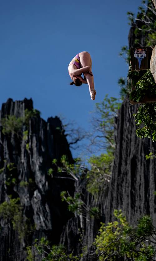 Molly Carlson of Canada executes a stunning dive from 21.5 metres during the inaugural Red Bull Cliff Diving World Series 2025 at Lagen Island, El Nido, Philippines