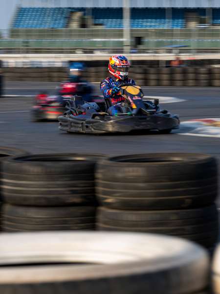 Sebastian Job drives a Red Bull Racing Esports kart during Max vs 100 at Silverstone, Great Britain, on 22 July 2026, powering through the tyre-lined circuit.
