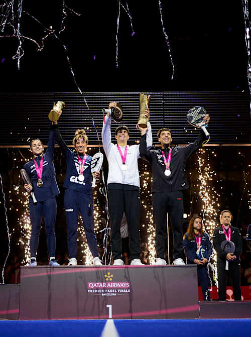 Claudia Fernandez Sanchez, Beatriz Gonzalez Fernandez, Agustin Tapia and Arturo Coello celebrate with their winner trophies at the Qatar Airways Premier Padel Finals in Barcelona, Spain, 2025