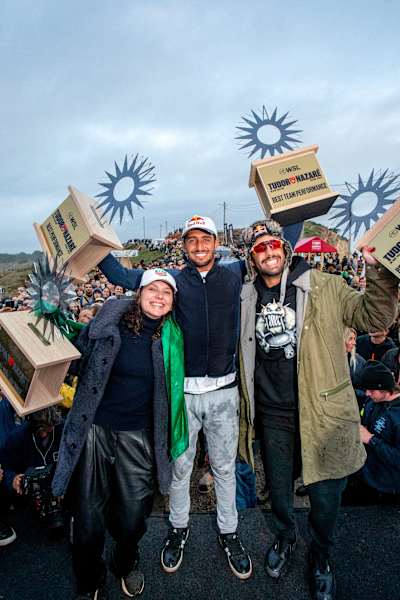 Lucas Chianca, Pedro Scooby and Maya Gabeira celebrate on the podium during WSL Big Wave Tour in Nazare, Portugal, on January  22, 2024.