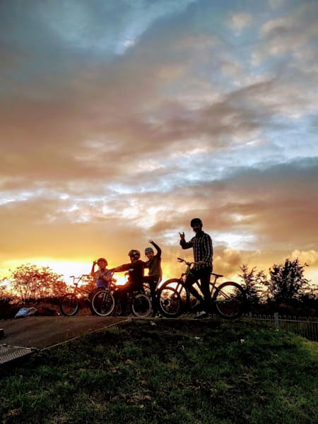Riders begin an evening session at Bearsden BMX track