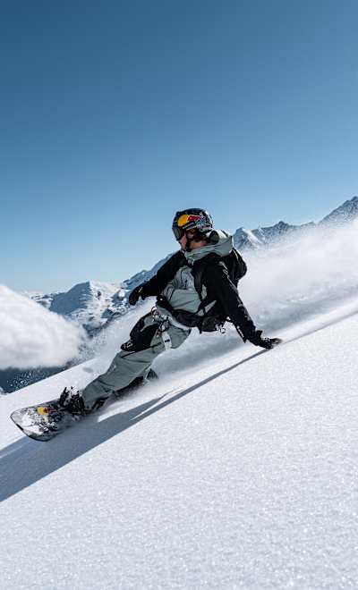 Brock Crouch slashing pow during the Red Bull Alpine Camp in Zermatt on May 18, 2024.