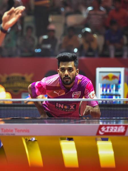 Harmeet Desai and Sanil Shetty play during a match at Ultimate Tablle Tennis