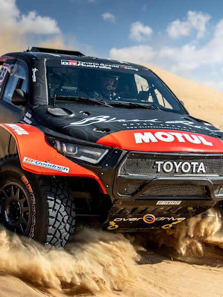 In 2025, Toby Price races his Motul Toyota rally car, kicking up dust on desert dunes while training for Rally Dakar.