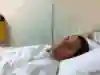 Quinn Darragh photographed in a hospital bed.