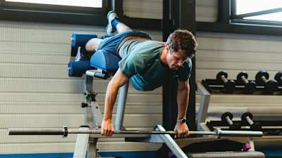 Clément Noël working out in a gym.