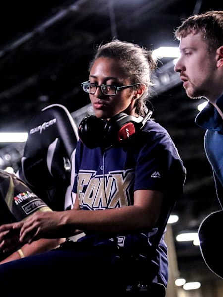 Tekken pro player Cuddle Core at EVO 2019 in conversation with team-mate Joey Fury.